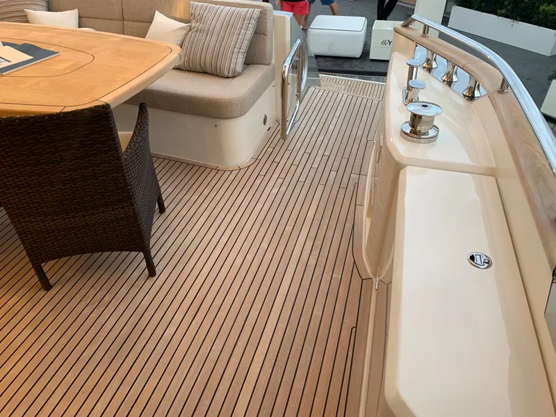 Slide: The Image of Monte Carlo Yachts MCY 65 2018 model, elegant deck with seating and table. - 27
