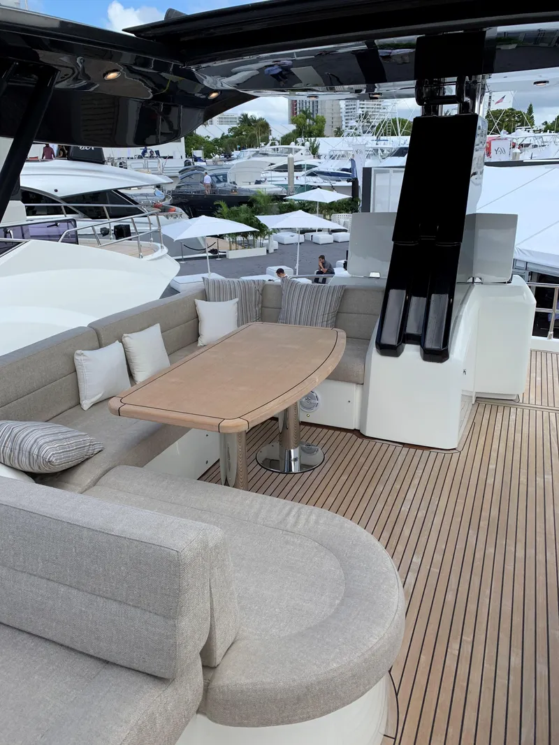 Slide: The Image of 2018 Monte Carlo Yachts MCY 65 luxury yacht with spacious outdoor seating area. - 30