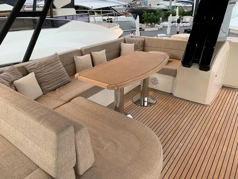 Slide: The Image of Luxurious seating area on the 2018 Monte Carlo Yachts MCY 65 with teak flooring. - 31