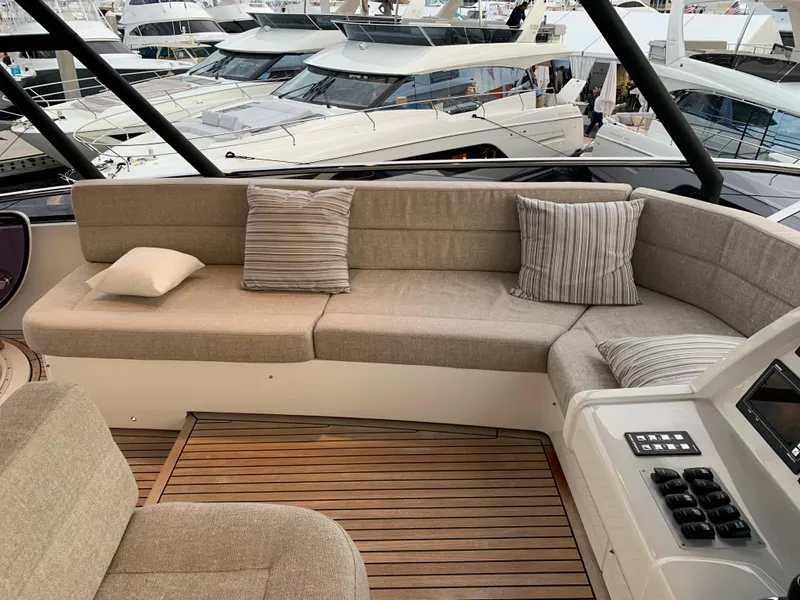 Slide: The Image of Luxurious seating area on the 2018 Monte Carlo Yachts MCY 65 with striped cushions. - 33