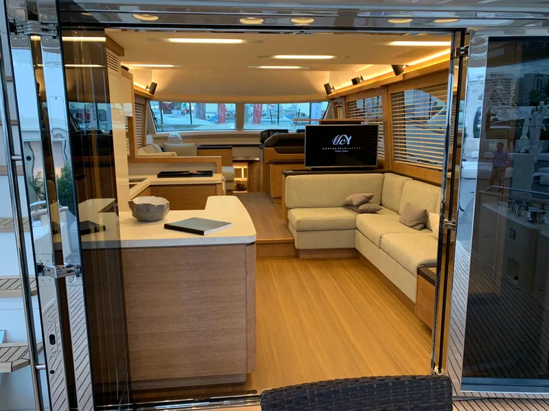 Slide: The Image of Luxurious interior of 2018 Monte Carlo Yachts MCY 65 with modern furnishings and elegant design. - 39