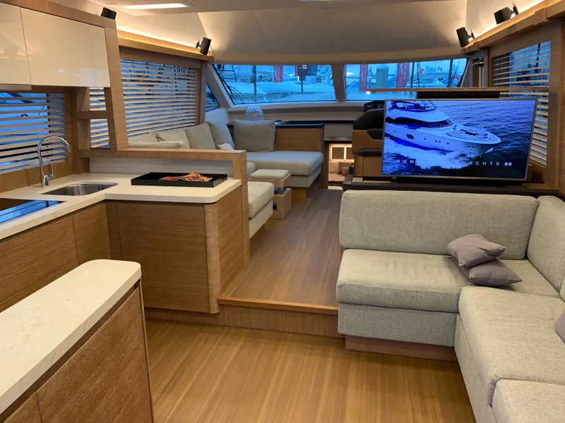 Slide: The Image of Luxurious interior of 2018 Monte Carlo Yachts MCY 65 with modern furnishings and large windows. - 41