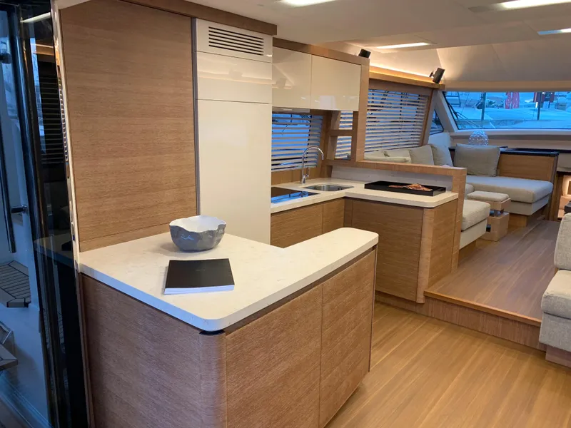 Slide: The Image of Modern interior of 2018 Monte Carlo Yachts MCY 65 with sleek kitchen and cozy seating area. - 42