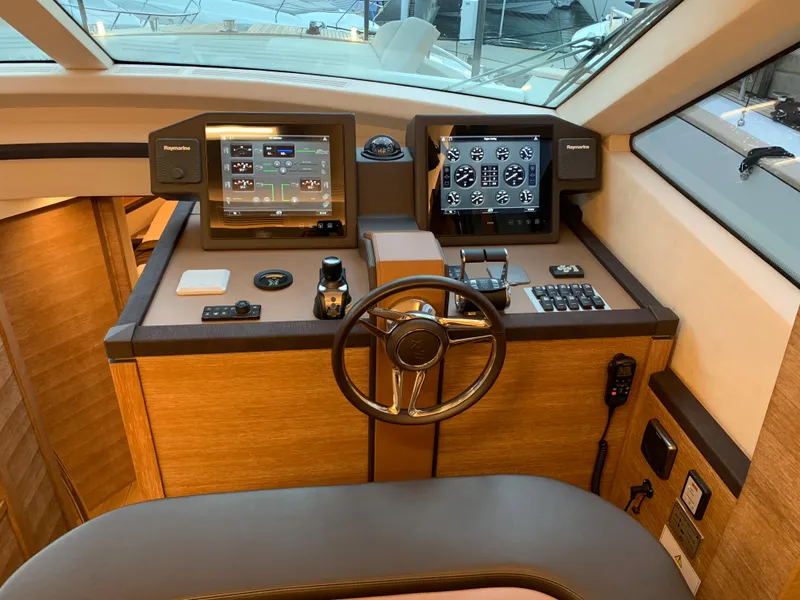 Slide: The Image of 2018 Monte Carlo Yachts MCY 65 helm station with advanced navigation systems. - 48