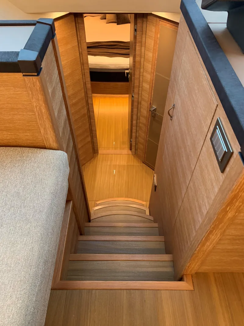 Slide: The Image of Interior stairs of 2018 Monte Carlo Yachts MCY 65, leading to lower deck. - 49