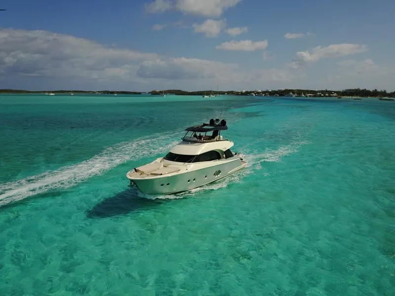 Slide: The Image of Monte Carlo Yachts MCY 65 2018 cruising in clear turquoise waters. - 6