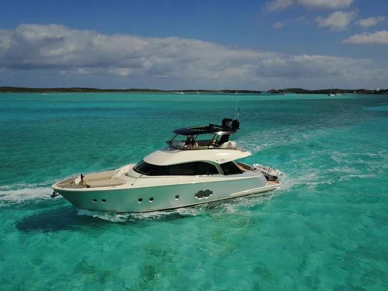 Slide: The Image of 2018 Monte Carlo Yachts MCY 65 cruising in clear turquoise waters. - 7