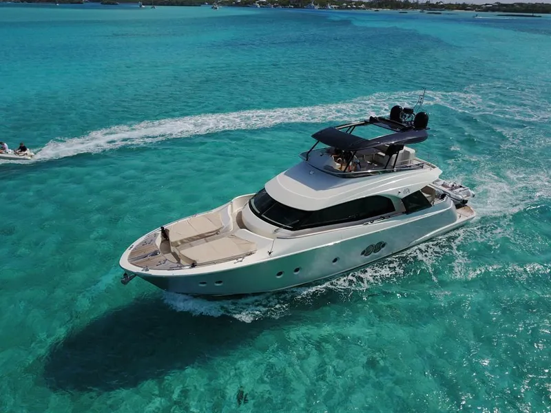 Slide: The Image of 2018 Monte Carlo Yachts MCY 65 cruising in clear turquoise waters. - 8