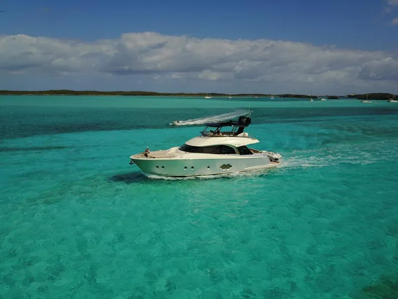 Slide: The Image of 2018 Monte Carlo Yachts MCY 65 cruising in clear turquoise waters. - 9