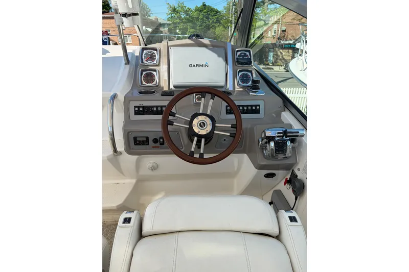 Slide: The Image of Cockpit of 2013 Chaparral 310 Signature boat with Garmin navigation system. - 15