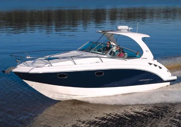 Slide: The Image of Manufacturer Provided Image: 2013 Chaparral 310 Signature cruising on calm waters. - 2