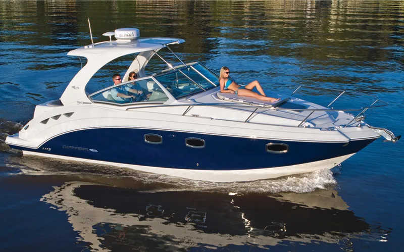 Slide: The Image of Manufacturer Provided Image: 2013 Chaparral 310 Signature boat cruising on water with passengers. - 3
