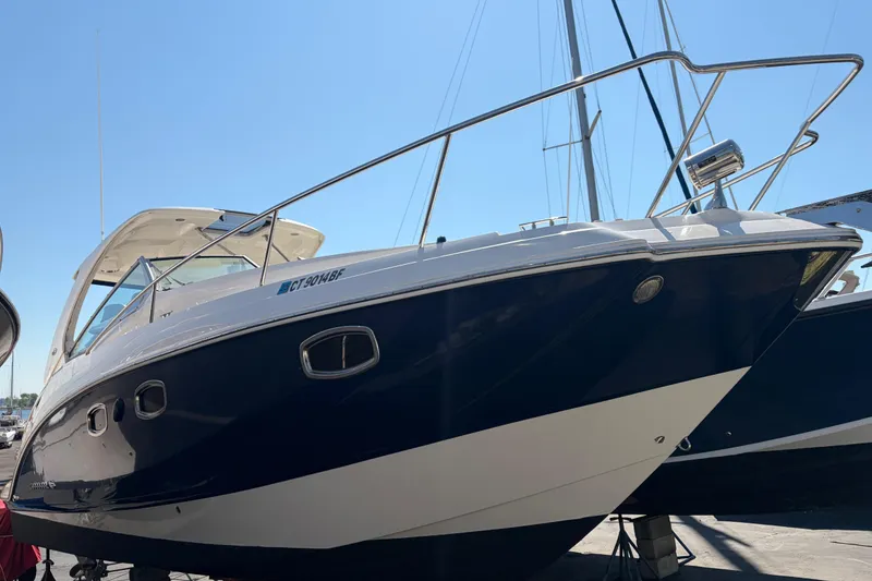 The Image of 2013 Chaparral 310 Signature boat on display, showcasing sleek design and modern features. - 0