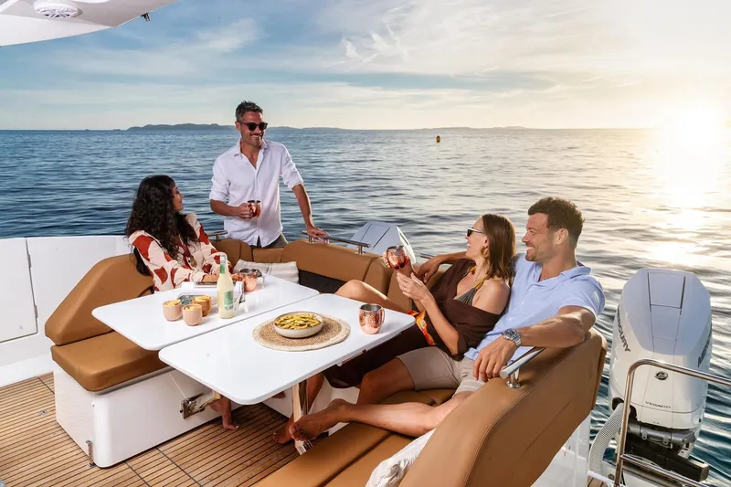 Slide: The Image of Manufacturer Provided Image: People enjoying a sunset cruise on a 2026 Jeanneau TH38 yacht. - 6