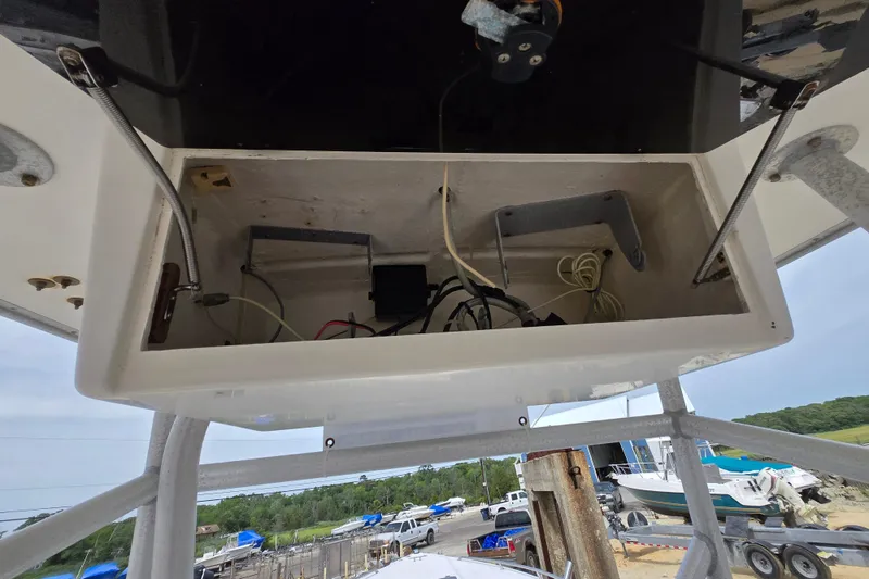 Slide: The Image of Open electronics compartment on a 1988 Baja 280 Sportfish boat, showing wiring and components. - 11