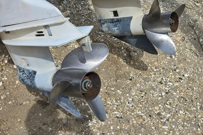 Slide: The Image of Propellers of a 1988 Baja 280 Sportfish boat on gravel surface. - 13
