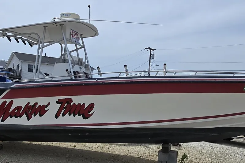Slide: The Image of 1988 Baja 280 Sportfish boat with "Makin' Time" text, for sale sign visible. - 4