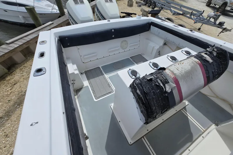 Slide: The Image of 1988 Baja 280 Sportfish boat interior with dual engines and seating area. - 8