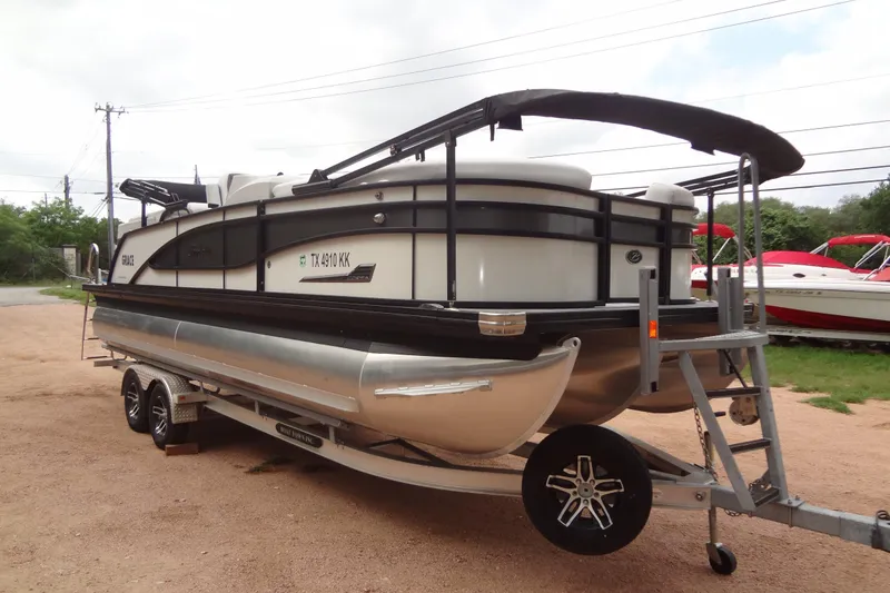 The Image of 2021 Baraletta Corsa 23 QSS pontoon boat on trailer, parked outdoors. - 0