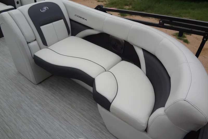 Slide: The Image of Luxurious seating in a 2021 Baraletta Corsa 23 QSS boat, featuring elegant white and gray upholstery. - 11