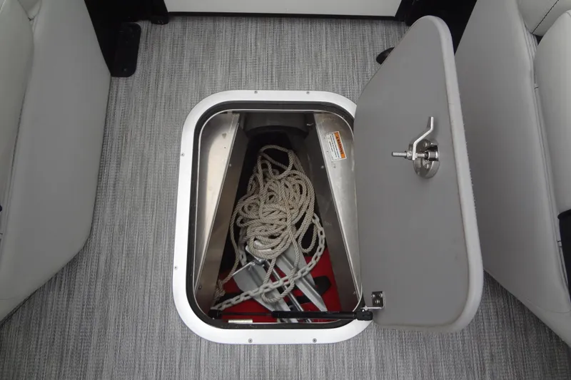 Slide: The Image of Open storage compartment on 2021 Baraletta Corsa 23 QSS boat with rope and anchor. - 14