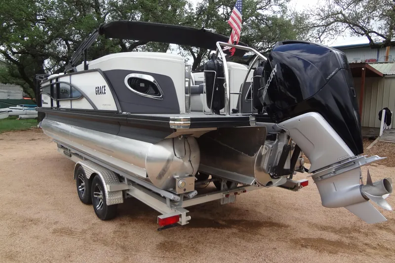 Slide: The Image of 2021 Baraletta Corsa 23 QSS pontoon boat with Mercury outboard motor on trailer. - 4