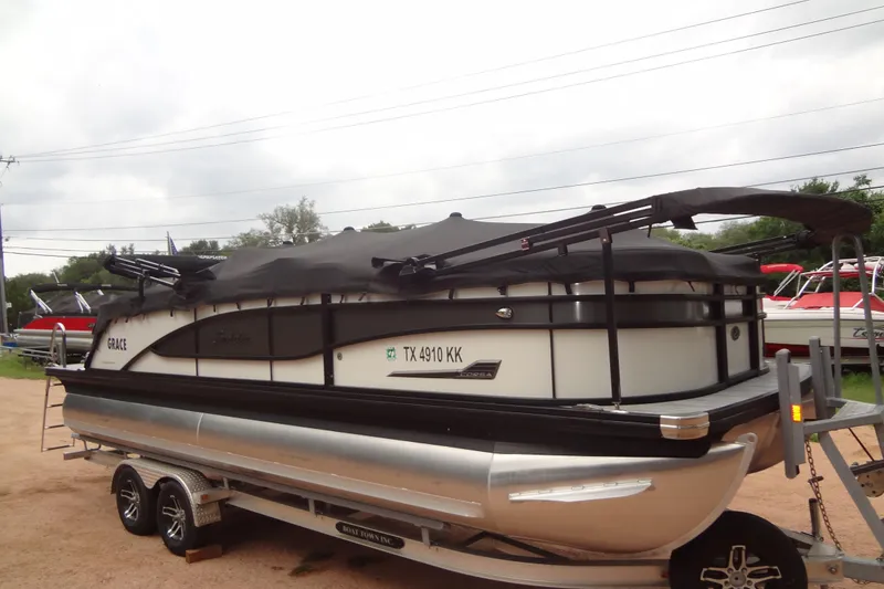 Slide: The Image of 2021 Baraletta Corsa 23 QSS pontoon boat on trailer, covered and parked outdoors. - 51