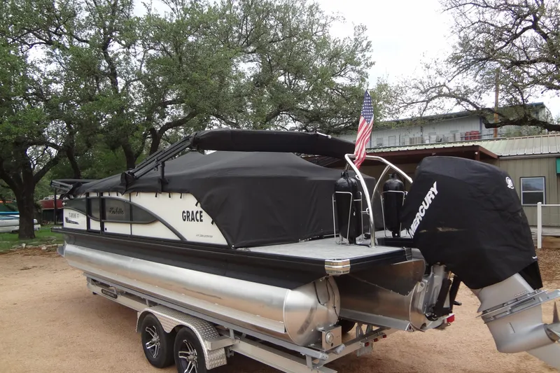 Slide: The Image of 2021 Baraletta Corsa 23 QSS pontoon boat on trailer, covered and parked outdoors. - 52