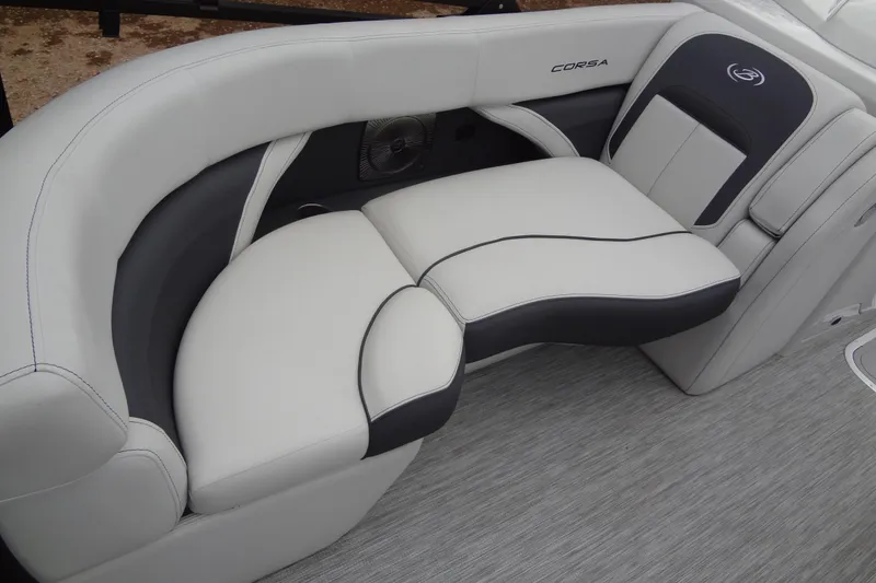 Slide: The Image of Luxurious seating in a 2021 Baraletta Corsa 23 QSS boat, featuring elegant white and black upholstery. - 9
