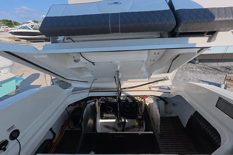Slide: The Image of Open engine compartment of 2023 Monterey 305SS Super Sport boat at marina. - 12
