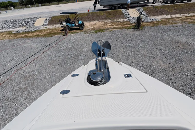 Slide: The Image of Bow view of 2023 Monterey 305SS Super Sport boat on gravel surface. - 10
