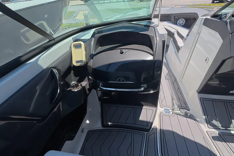 Slide: The Image of 2023 Monterey 305SS Super Sport boat interior with sleek seating and modern design. - 22