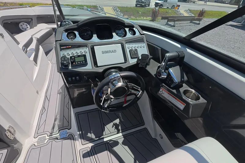 Slide: The Image of Cockpit of 2023 Monterey 305SS Super Sport boat with advanced controls and navigation system. - 20
