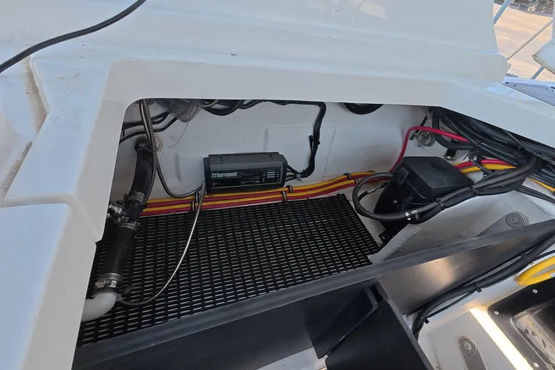 Slide: The Image of 2023 Monterey 305SS Super Sport engine compartment with wiring and components visible. - 13