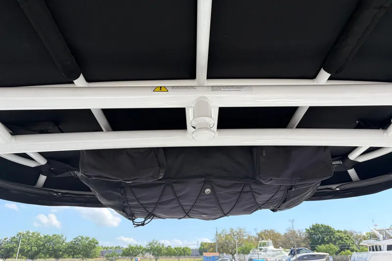 Slide: The Image of View of the 2023 Monterey 305SS Super Sport boat's overhead storage and framework. - 18