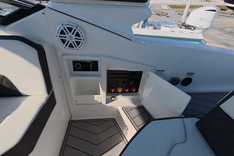 Slide: The Image of Interior view of 2023 Monterey 305SS Super Sport boat, featuring seating and control panel. - 15