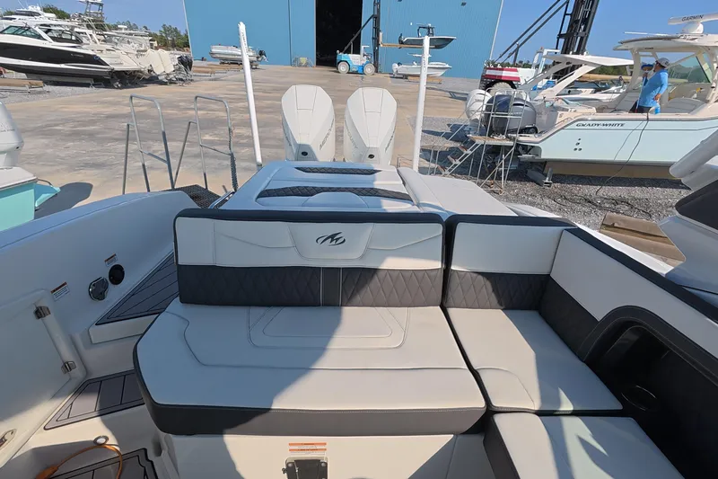 Slide: The Image of 2023 Monterey 305SS Super Sport boat interior with luxurious seating and modern design. - 11