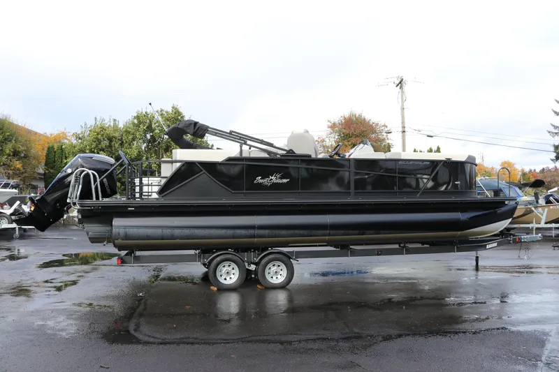 The Image of 2024 SunChaser Eclipse LR DH 25 Demo pontoon boat on trailer, parked outdoors. - 0