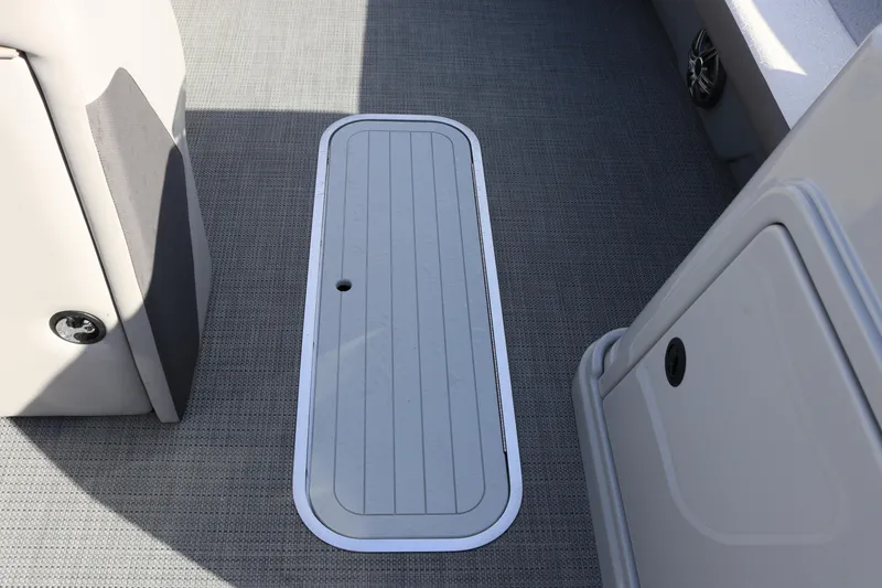 Slide: The Image of 2024 SunChaser Eclipse LR DH 25 Demo boat interior with storage compartment. - 10
