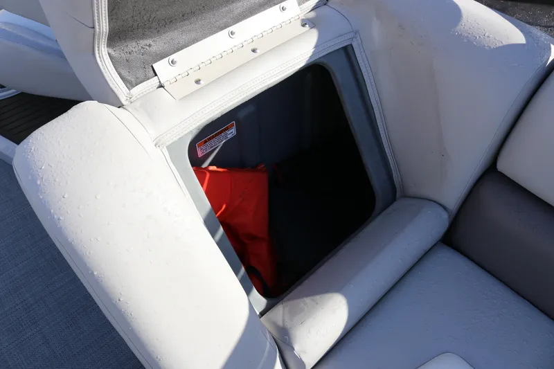 Slide: The Image of Open storage compartment in 2024 SunChaser Eclipse LR DH 25 Demo boat seat. - 17