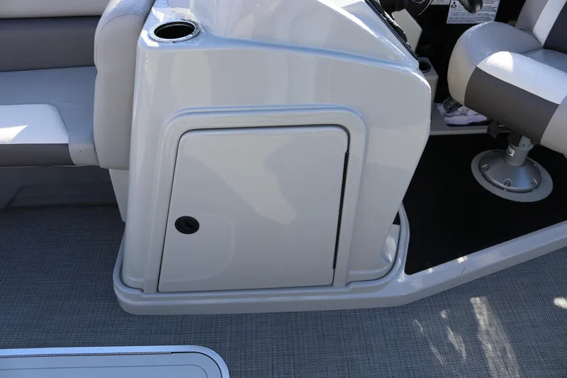Slide: The Image of 2024 SunChaser Eclipse LR DH 25 Demo boat interior with seating and storage compartment. - 18
