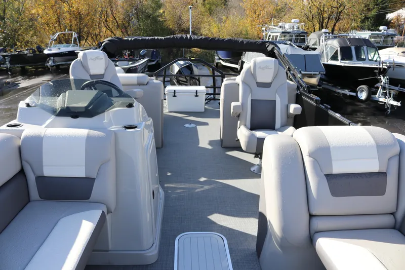 Slide: The Image of 2024 SunChaser Eclipse LR DH 25 Demo pontoon boat interior with plush seating. - 23