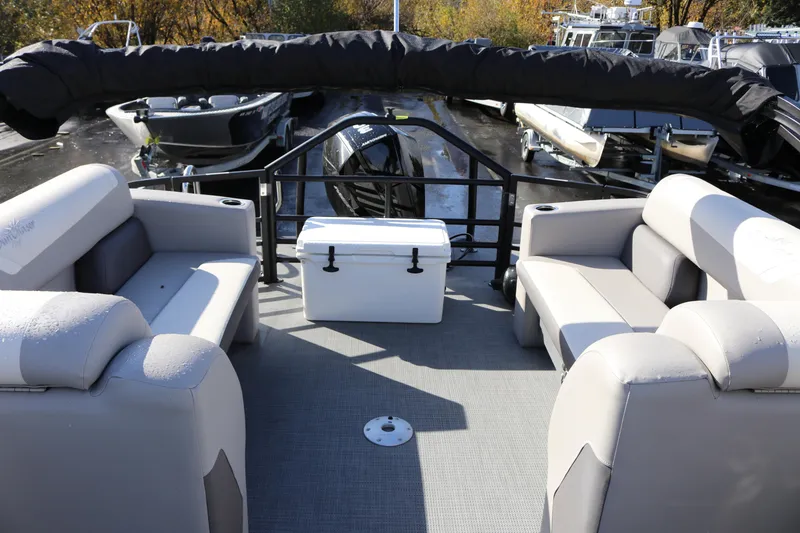 Slide: The Image of 2024 SunChaser Eclipse LR DH 25 Demo pontoon boat interior with seating and cooler. - 28