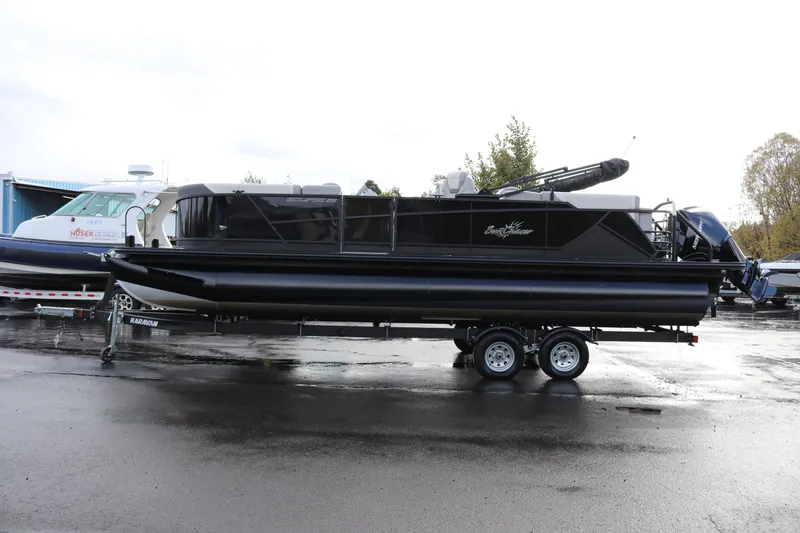 Slide: The Image of 2024 SunChaser Eclipse LR DH 25 Demo pontoon boat on trailer, parked outdoors. - 4