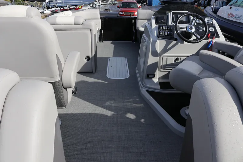 Slide: The Image of Interior view of 2024 SunChaser Eclipse LR DH 25 Demo boat with modern seating and controls. - 6