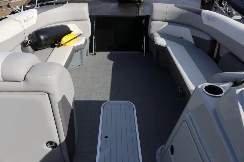 Slide: The Image of Interior of 2024 SunChaser Eclipse LR DH 25 pontoon boat with gray seating and flooring. - 9