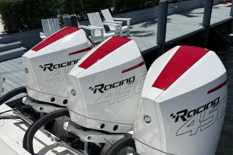 Slide: The Image of Triple Mercury Racing 450 engines on a 2023 Fountain 38 SCX boat at a dock. - 10