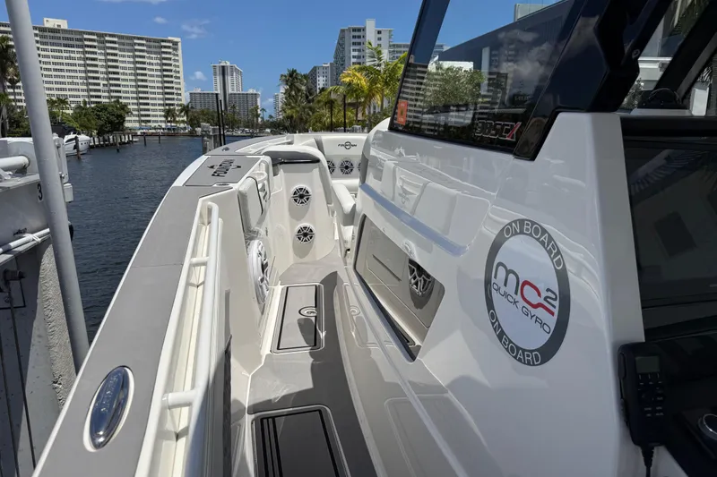 Slide: The Image of 2023 Fountain 38 SCX boat docked, featuring sleek design and modern amenities. - 11