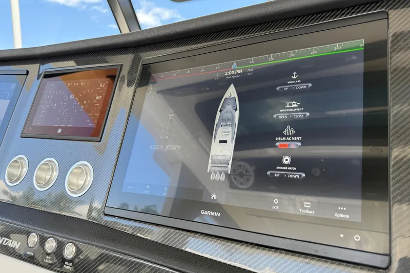 Slide: The Image of Dashboard of 2023 Fountain 38 SCX boat with Garmin navigation display. - 14
