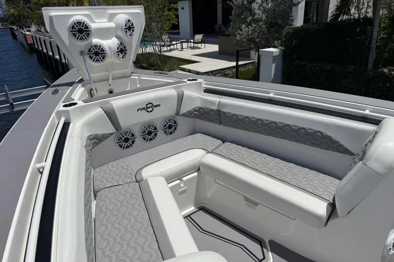 Slide: The Image of 2023 Fountain 38 SCX boat interior with luxurious seating and built-in speakers. - 16